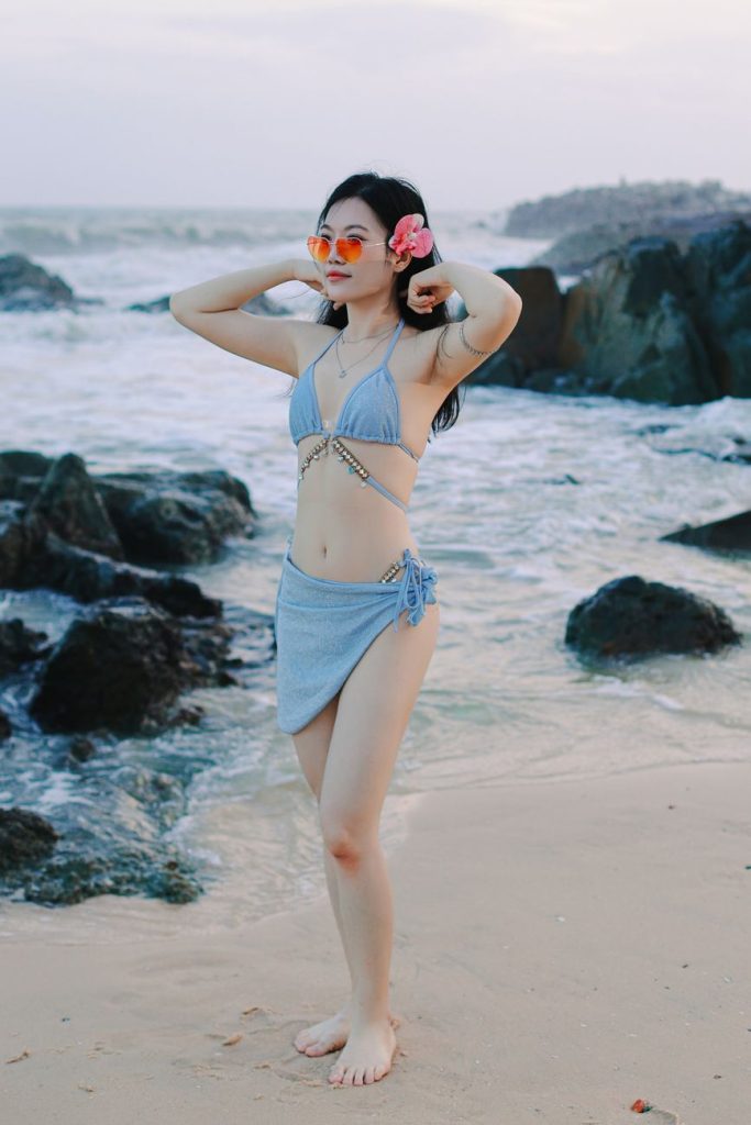 Woman in a bikini by the water