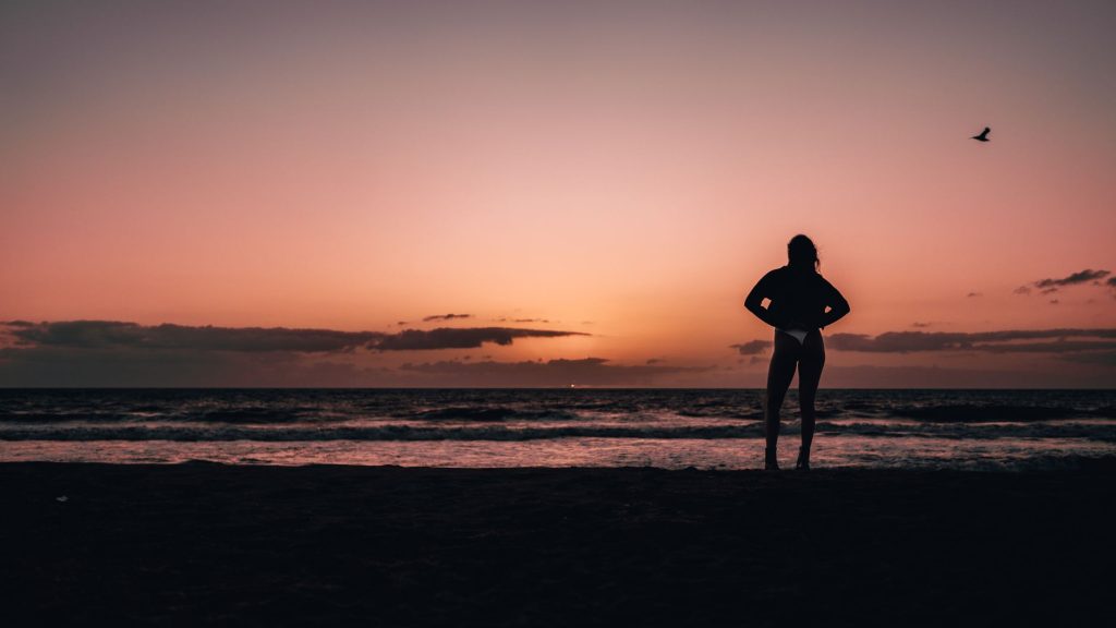 Woman in a bikini by the water