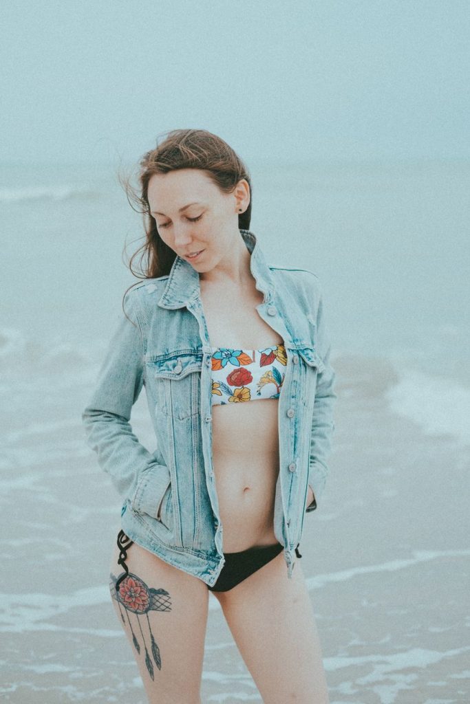 Woman in a bikini by the water